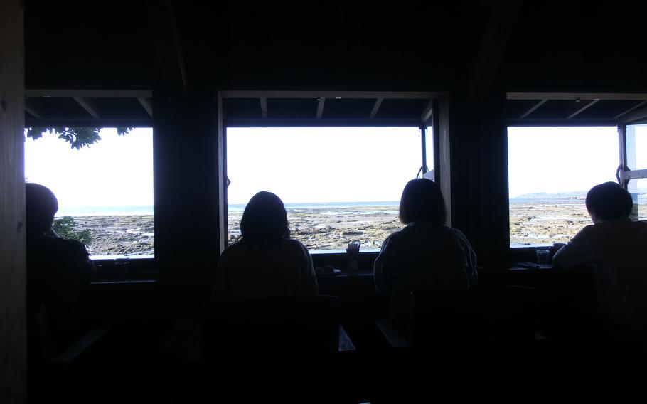 Customers enjoy the ocean view from their counter seats.